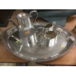 Four piece Victorian silver plated tea set, together with an ornate pierced silver plated oval tray