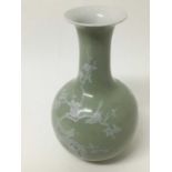 18th century style Chinese celedon glazed porcelain vase with character marks to base.