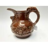 Castle Hedingham Edward Bingham brown glazed pottery jug, with lion on handle and mask decoration, 2