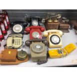 Vintage black Bakelite telephone together with a collection of other vintage coloured telephones