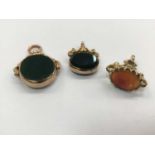 Three 9ct gold mounted fobs