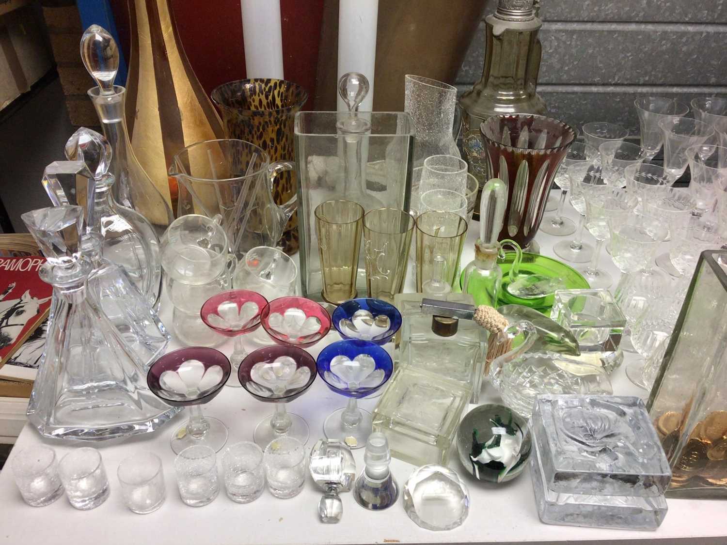 Large group of assorted glassware to include decanters and coloured glass