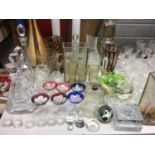 Large group of assorted glassware to include decanters and coloured glass