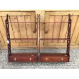 Pair of reproduction open hanging shelves, each with pierced sides and single drawer