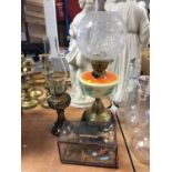 Early 20th century oil lamp, together with another oil lamp and a Chinese diorama (3)