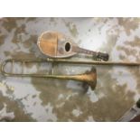 Brass tenor trombone together with a mandolin (2)