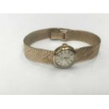 Lady's Omega 9ct gold wristwatch on integral gold Milanese bracelet