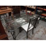 Contemporary glass and wrought iron dining table and three matching chairs