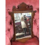 Georgian mahogany wall mirror with shaped scroll frame