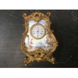 Late 19th / early 20th century French painted porcelain catouche shaped clock