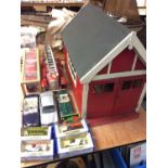 Group toy cars including tin plate fire engine and wooden fire station