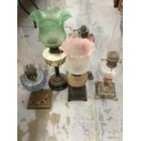 Collection of five antique oil lamps