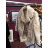 Ladies cream fur coat, mink stole, and a further faux astrakhan black jacket