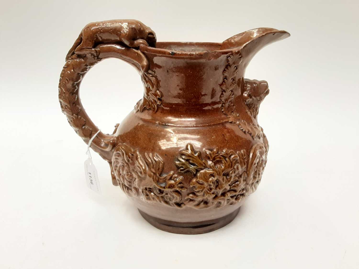 Castle Hedingham Edward Bingham brown glazed pottery jug, with lion on handle and mask decoration, 2 - Image 3 of 6
