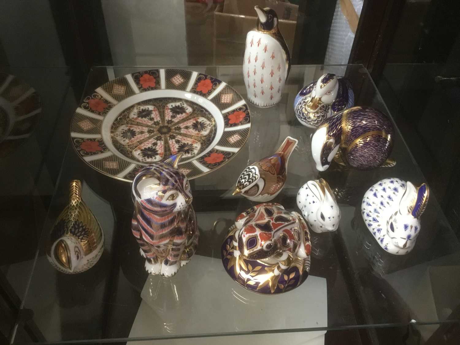 Group of nine Crown Derby paperweights