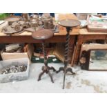 Two mahogany torchères with spiral twist columns and a Victorian inlaid walnut table (3)