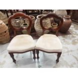 Set of four Victorian mahogany dining chairs with upholstered seats on turned front legs