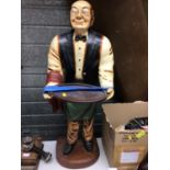 Large free standing figure of a waiter