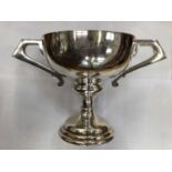 Silver plated two handled trophy cup, silver plated tea and coffee set with fluted decoration and ot