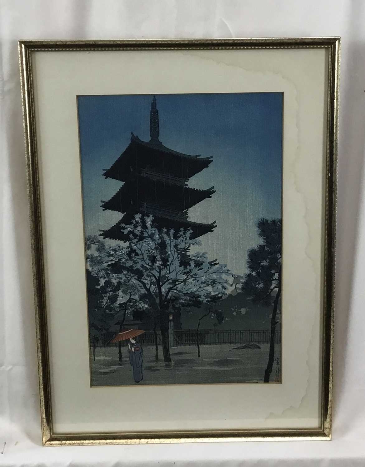 Japanese woodblock print in frame, depicting a female figure holding a parasol with a pagoda in the - Image 3 of 4