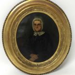 English School, mid 19th century, oil on canvas, oval, portrait of an austere woman with glasses and