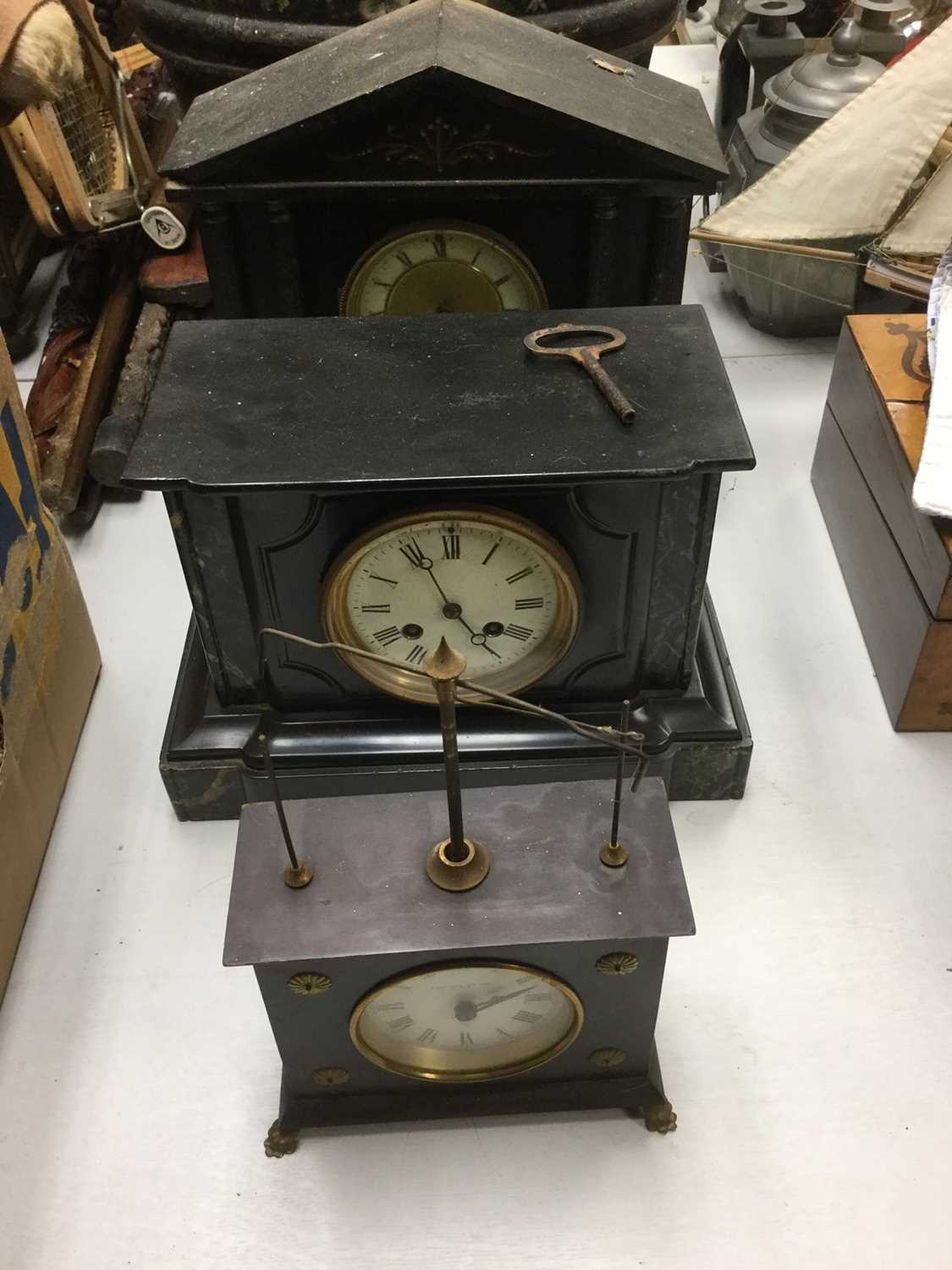 Two black slate mantel clocks and one other mantel clock (3)