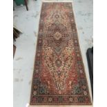 Eastern runner with geometric decoration on multi coloured ground, 232cm x 79cm