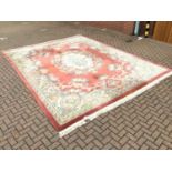 Large Chinese was rug with floral decoration on terracotta and cream ground 367cm x 470cm