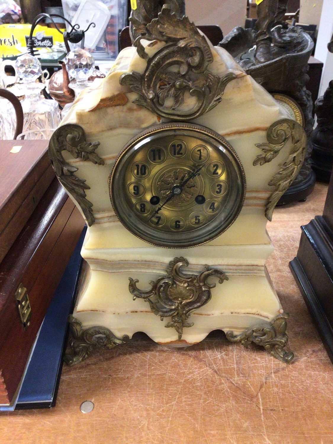 Ornate onyx and gilt metal mantel clock