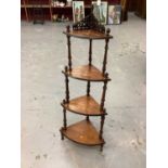 Victorian inlaid figured walnut veneered four tier bow front whatnot with pierced fretwork and spira