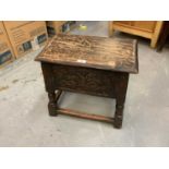 Antique carved oak coffin stool with rising lid