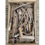 Four wooden crates containing vintage tools or various forms, cast iron boot scrapper, shooting stic