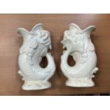 Pair of Wedgwood cream glazed fish gluggle jugs