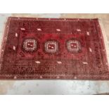 Eastern rug with geometric decoration on red and black ground, 122cm x 78cm