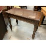 Edwardian oak rectangular card table with fold-over top, on carved legs