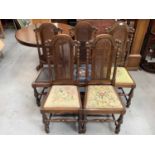 Set of five oak dining chairs with caned arched backs, four with tapestry seats