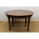 Good quality early 20th century mahogany dining table and two leaves on massive bulbous legs.