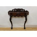 Victorian mahogany console/hall table with carved and pierced back and shaped frieze drawer on scrol