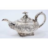 George IV silver teapot of compressed melon form, with panels of foliate decoration