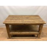 Rustic two tier pine kitchen table, with plank top and undertier raised on square supports, 133cm wi