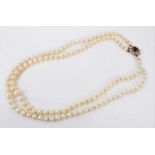 Cultured pearl two strand necklace with amethyst and pearl clasp