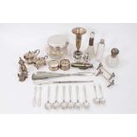 A selection of miscellaneous silver including pair knife rests, various condiments, trumpet vase, na