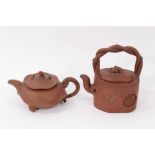 Two interesting Chinese terracotta teapots, one depicting lotus leaf with frog and snail