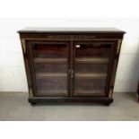 Victorian ebonised, boxwood line inlaid and gilt metal mounted glazed bookcase