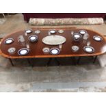 George III style mahogany crossbanded triple pedestal dining table, on spread supports and brass cap