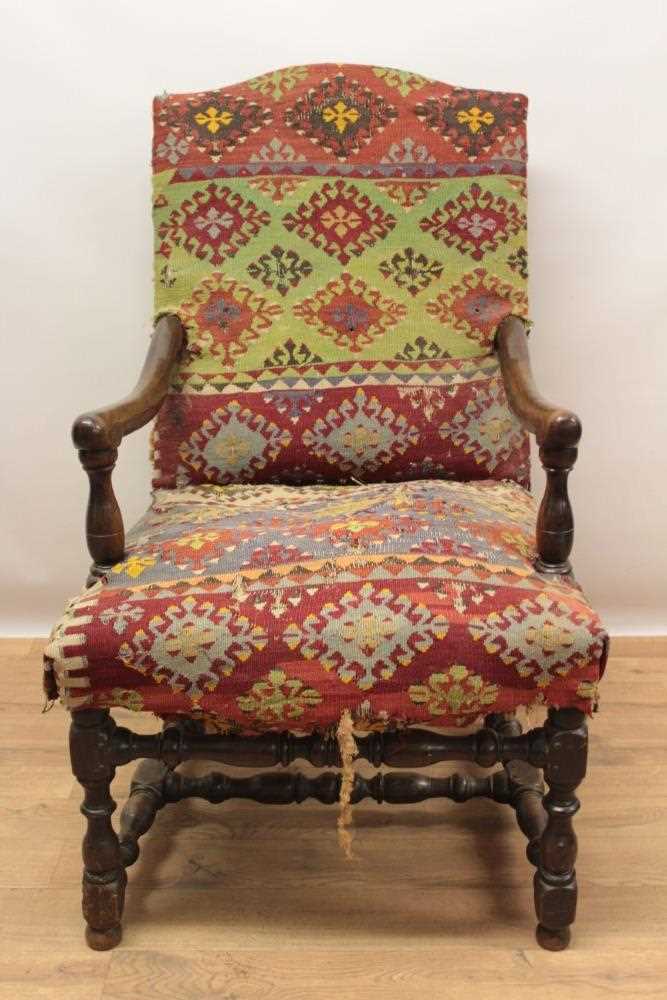 Good 17th century walnut armchair, the arched back and seat with Kelim upholstery on turned and bloc