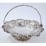 Victorian silver cake basket of circular form, with pierced scroll and floral decoration