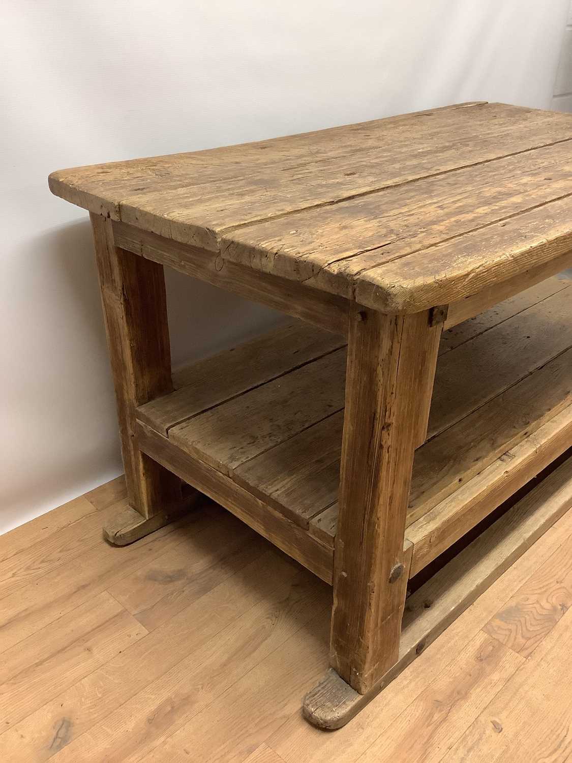 Rustic two tier pine kitchen table, with plank top and undertier raised on square supports, 133cm wi - Image 4 of 6