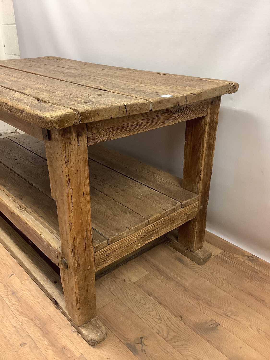 Rustic two tier pine kitchen table, with plank top and undertier raised on square supports, 133cm wi - Image 3 of 6