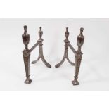 Pair of Georgian steel fire dogs with Adams style decoration, 27.5cm in height